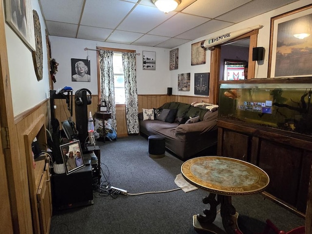 20 Central St, West Brookfield, MA 01585 - living room featuring wainscoting, a paneled ceiling, carpet floors, and wooden walls