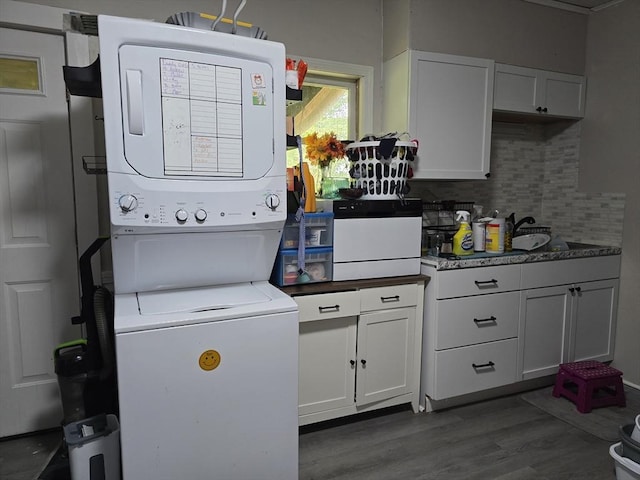 20 Central St, West Brookfield, MA 01585 - laundry room with stacked washer and clothes dryer and dark wood-type flooring