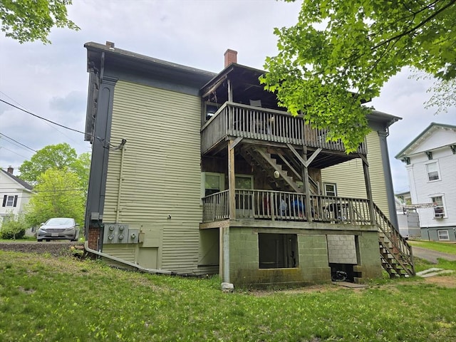 20 Central St, West Brookfield, MA 01585 - rear view of property featuring stairway, a deck, a yard, and a chimney