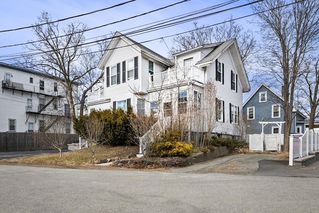 view of front of home featuring fence