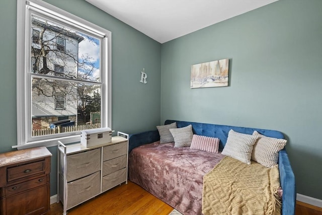 bedroom with wood finished floors