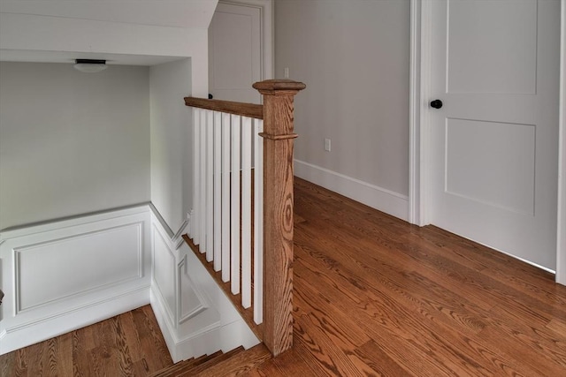 staircase with wood finished floors