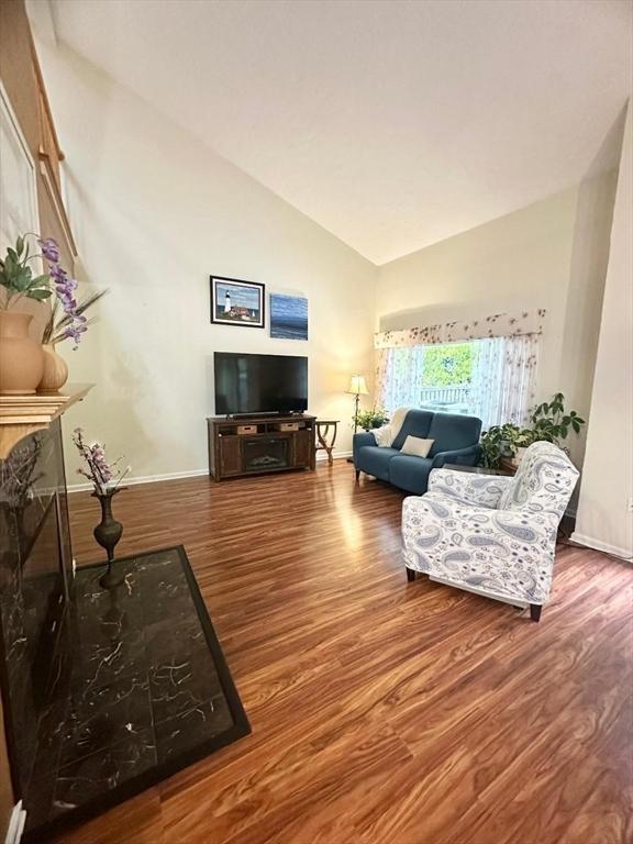 6 Tamarack Ln Unit 6, Peabody, MA 01960 - living room with vaulted ceiling and wood finished floors
