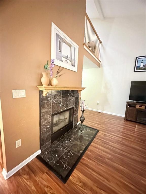6 Tamarack Ln Unit 6, Peabody, MA 01960 - living room featuring wood finished floors and a tile fireplace