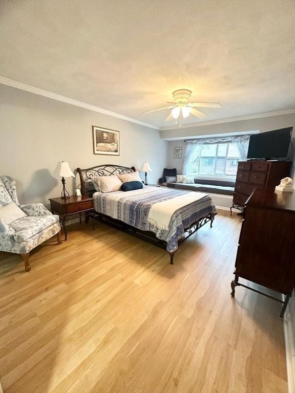 6 Tamarack Ln Unit 6, Peabody, MA 01960 - bedroom featuring crown molding, light wood-style flooring, and a ceiling fan