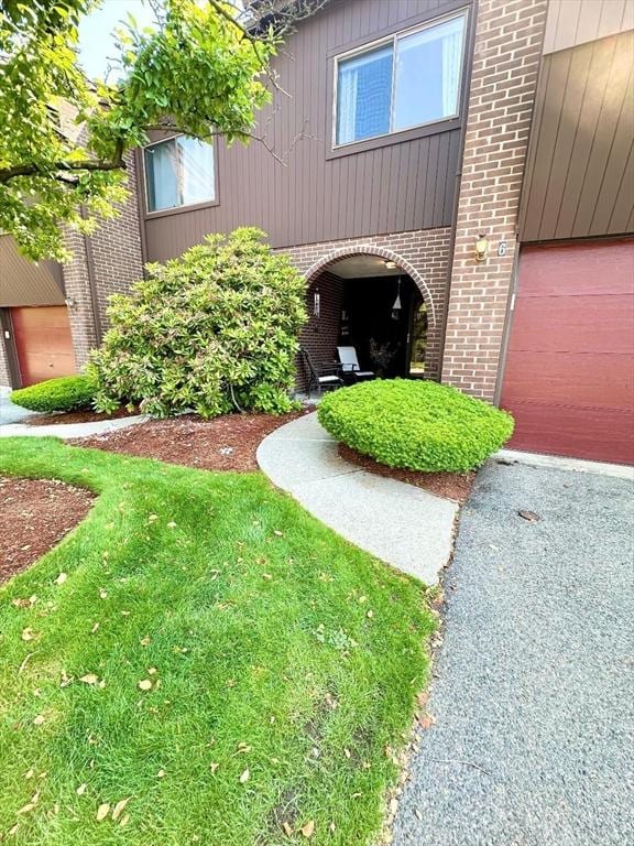 6 Tamarack Ln Unit 6, Peabody, MA 01960 - property entrance with brick siding and a garage