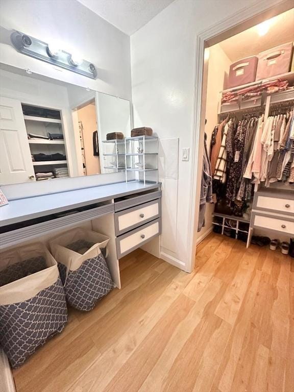 6 Tamarack Ln Unit 6, Peabody, MA 01960 - bathroom with wood finished floors, a walk in closet, and vanity