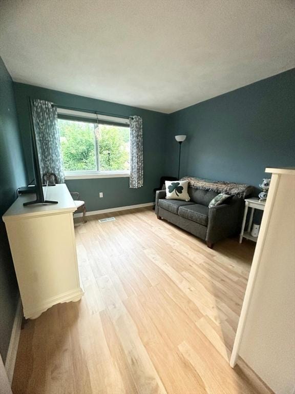6 Tamarack Ln Unit 6, Peabody, MA 01960 - living area with light wood-style flooring and baseboards