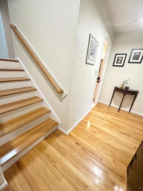 6 Tamarack Ln Unit 6, Peabody, MA 01960 - foyer featuring wood finished floors, stairs, and a textured wall