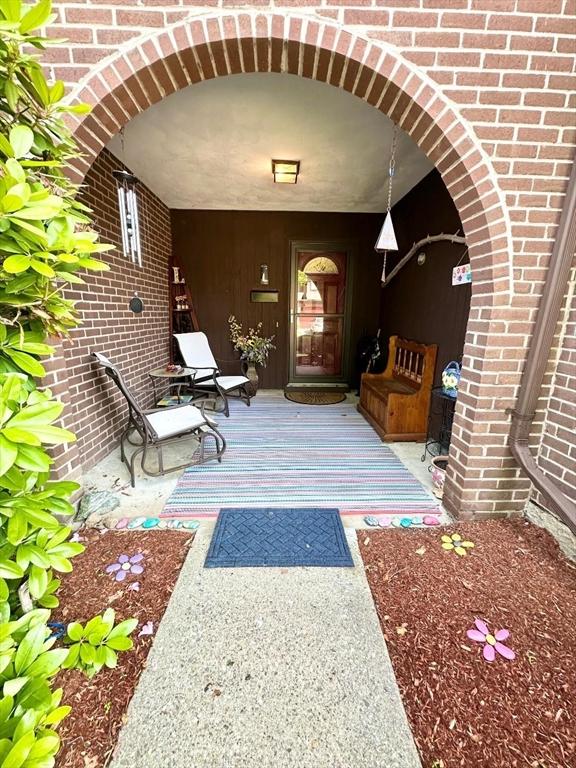 6 Tamarack Ln Unit 6, Peabody, MA 01960 - property entrance with a porch and brick siding