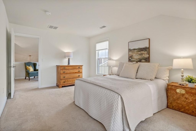 bedroom with light colored carpet, visible vents, and baseboards