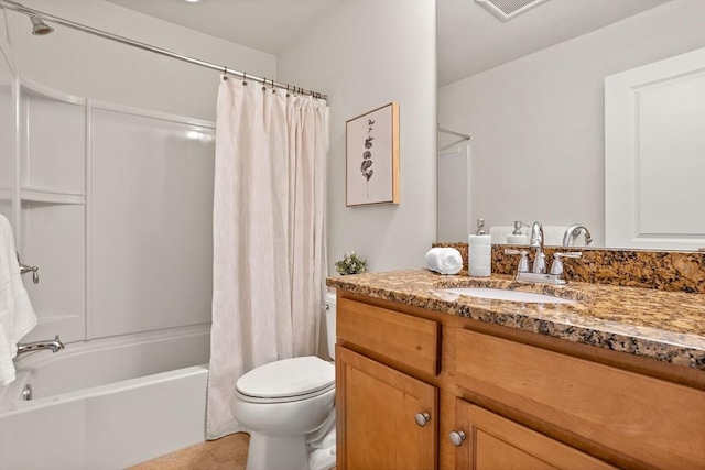 bathroom featuring visible vents, vanity, toilet, and shower / tub combo