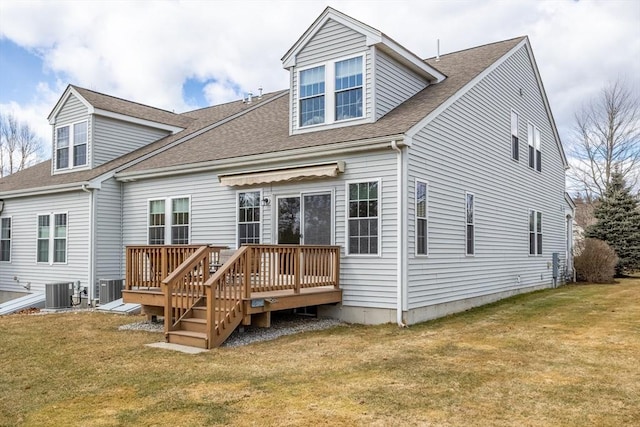 back of house featuring a lawn, cooling unit, and a deck