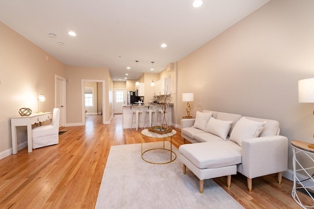 170 I St Unit 1, Boston, MA 02127 - living room featuring light wood-style flooring, baseboards, and recessed lighting