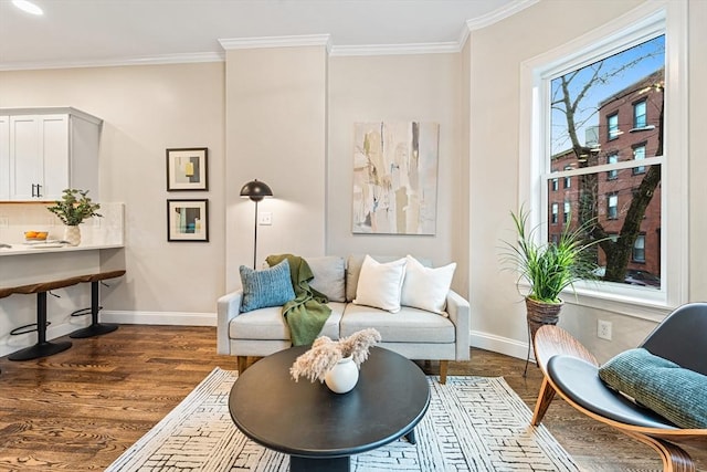 sitting room featuring dark hardwood / wood-style floors and ornamental molding