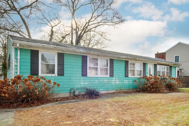 view of property exterior with a yard