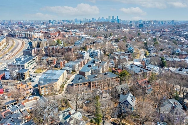 aerial view of property's location with nearby urban area