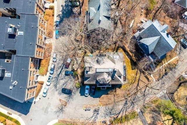 aerial view of property and surrounding area with apartment complex / building