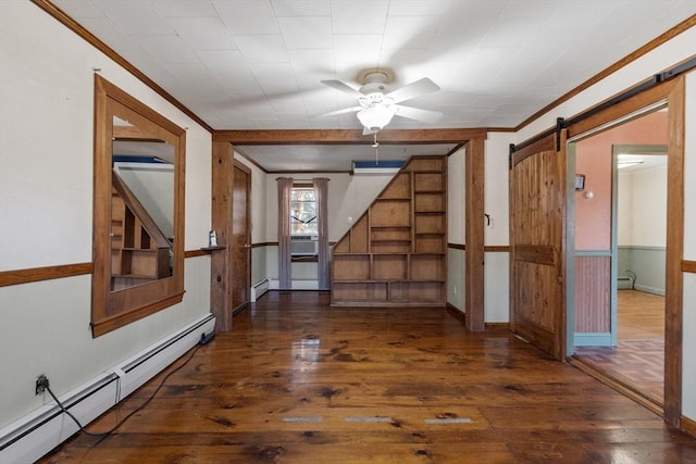 unfurnished room with crown molding, a baseboard heating unit, stairs, a barn door, and hardwood / wood-style floors