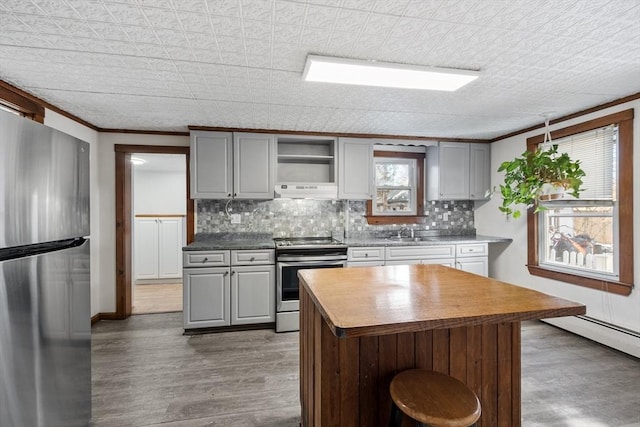 kitchen featuring gray cabinets, appliances with stainless steel finishes, and open shelves