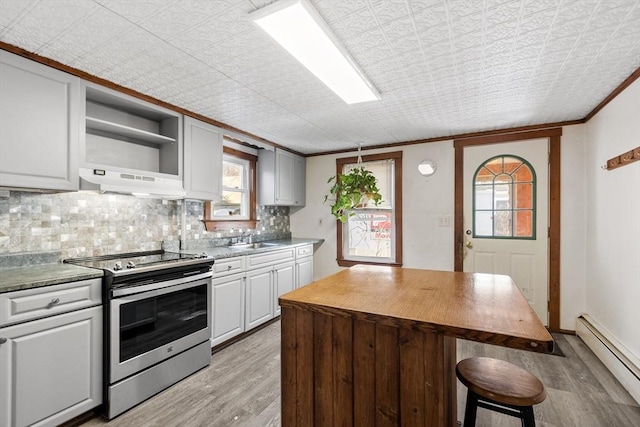 kitchen with light wood-type flooring, open shelves, electric range, a baseboard heating unit, and tasteful backsplash