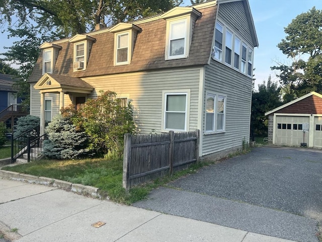 view of front of home featuring an outbuilding and a garage