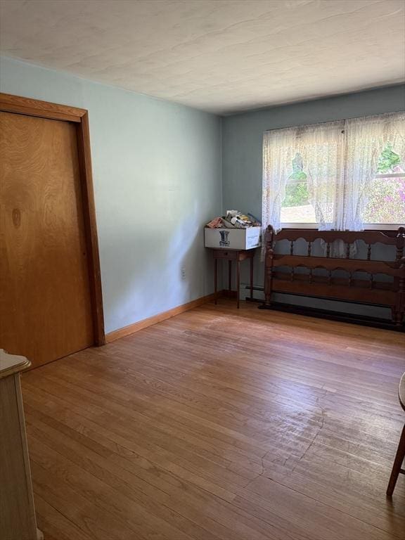 4 King Ln, Monson, MA 01057 - unfurnished room with baseboard heating, wood finished floors, and baseboards