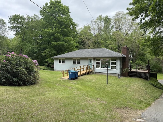 4 King Ln, Monson, MA 01057 - rear view of property featuring a chimney, a deck, a yard, and a wooded view