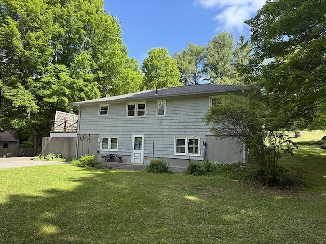4 King Ln, Monson, MA 01057 - rear view of house with a lawn and a patio area