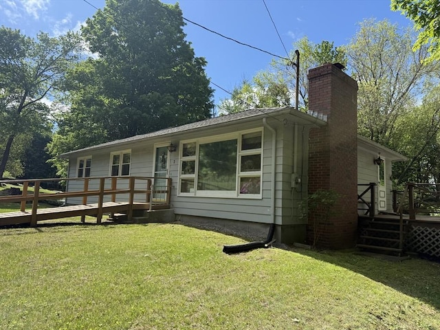 4 King Ln, Monson, MA 01057 - view of front of home with a deck, a chimney, and a front lawn