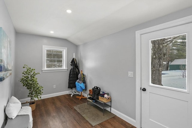 interior space with vaulted ceiling, recessed lighting, wood finished floors, and baseboards