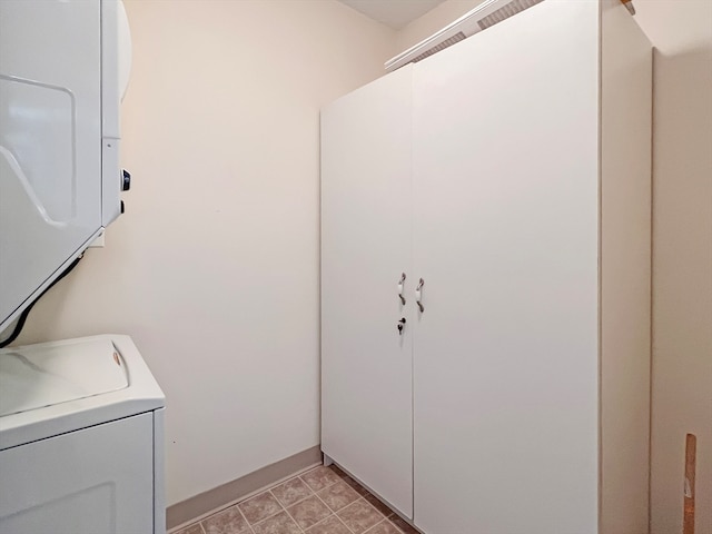 laundry room featuring stacked washer and dryer