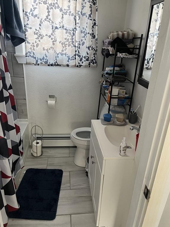 18 Dean St, Warren, MA 01083 - full bath with vanity, toilet, and baseboard heating