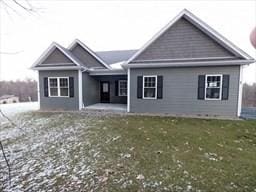 back of property featuring a yard and a patio