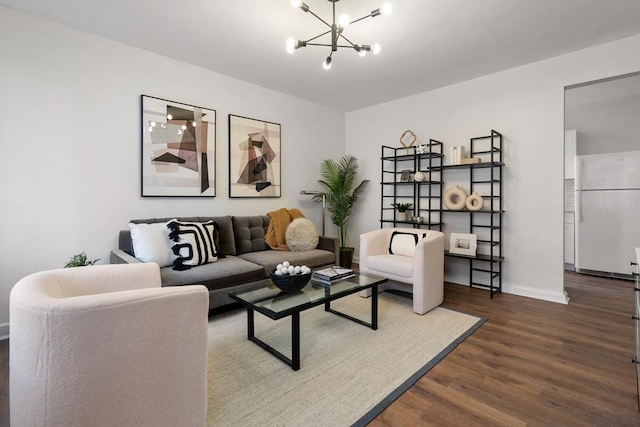 living room with an inviting chandelier and hardwood / wood-style floors