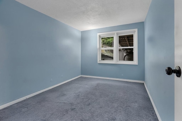 42 Charlotte Furnace Rd, Wareham, MA 02576 - carpeted empty room with a textured ceiling and baseboards