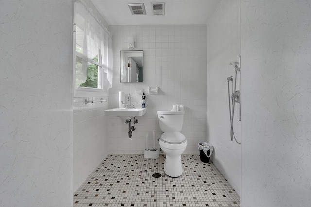 42 Charlotte Furnace Rd, Wareham, MA 02576 - full bathroom featuring tiled shower, tile patterned flooring, and tile walls