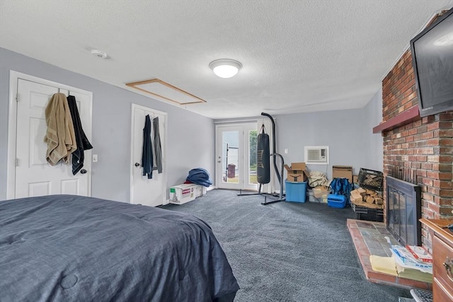 42 Charlotte Furnace Rd, Wareham, MA 02576 - carpeted bedroom with attic access, a brick fireplace, and a textured ceiling
