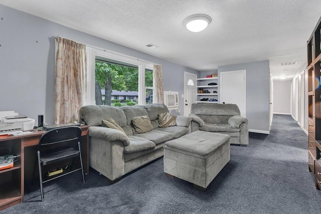 42 Charlotte Furnace Rd, Wareham, MA 02576 - living area featuring a textured ceiling, dark colored carpet, and an office area