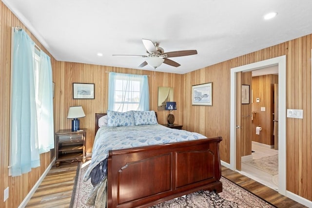 bedroom with ceiling fan and light wood-type flooring