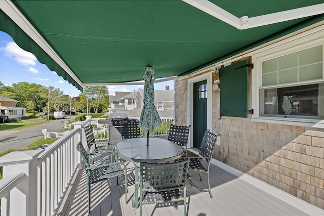 wooden terrace featuring a porch