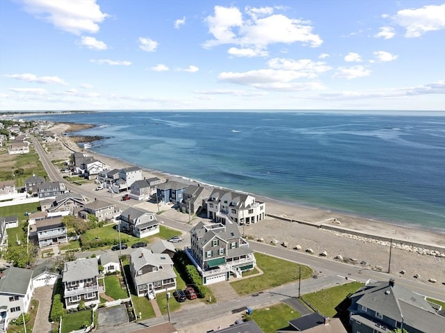 drone / aerial view with a water view and a view of the beach