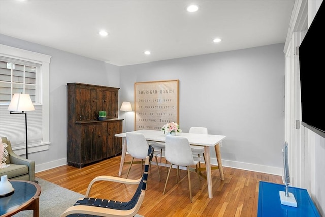 dining area with light hardwood / wood-style floors