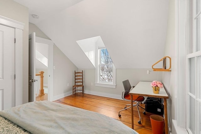 office space with hardwood / wood-style flooring and lofted ceiling