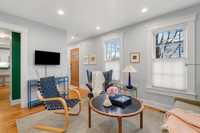 living room with light hardwood / wood-style flooring