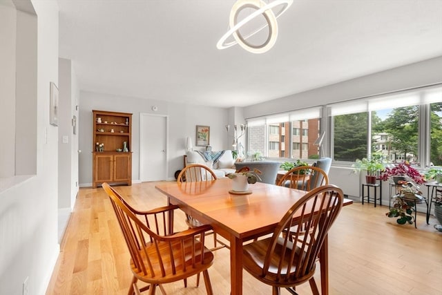 22 Chestnut Pl Unit 111, Brookline, MA 02445 - dining area featuring light wood-style flooring
