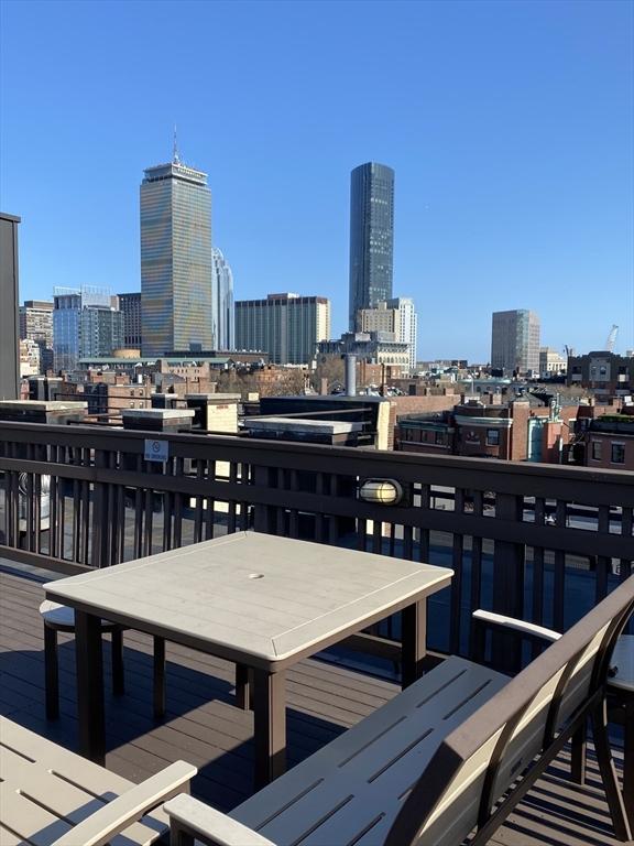 view of dock featuring a balcony and a city view