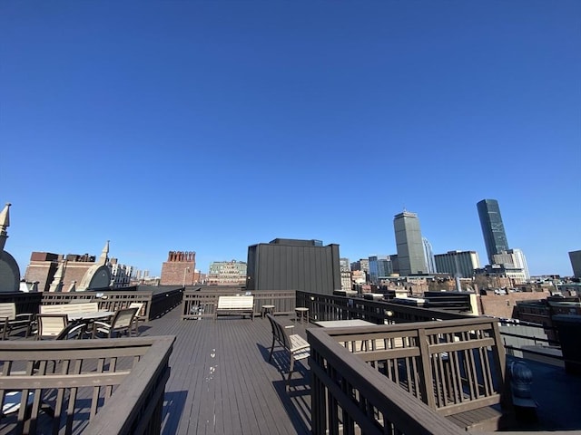 wooden deck featuring a city view