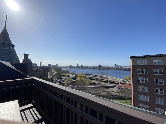 balcony with a view of city and a water view