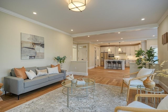 living room with ornamental molding and light wood-type flooring